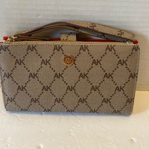 NWOT. Anne Klein phone wallet/wristlet colors are brown and tan.